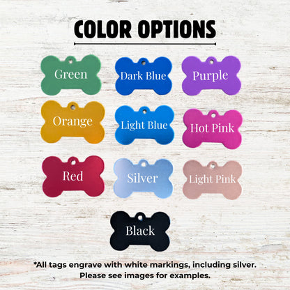 Color options for bone-shaped pet tags on a wooden background