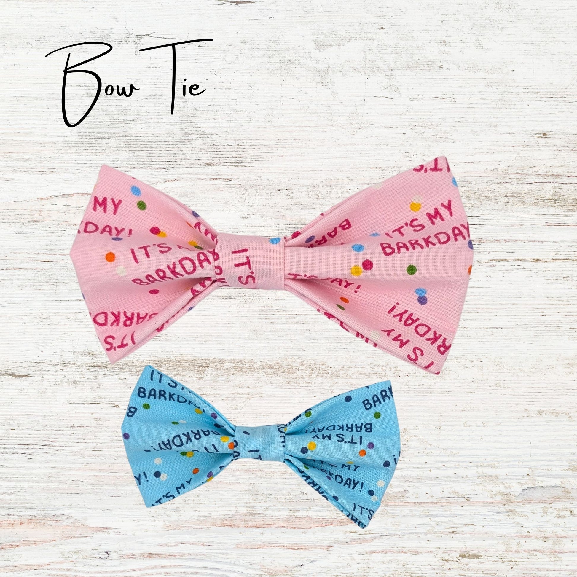 Pet Bowties on a light wooden background. The bowties are pink and blue and have text saying "It's my barkday"