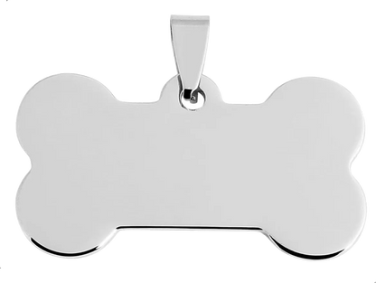 Silver bone-shaped pendant on a white background